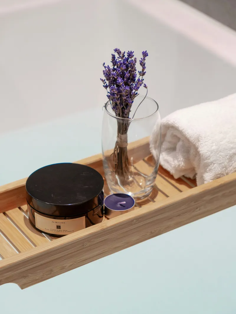 Lavender and skincare on a wooden tray
