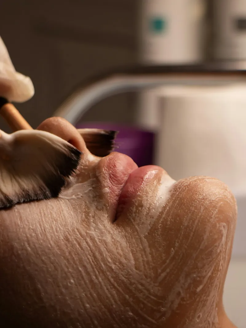 Facial mask being applied