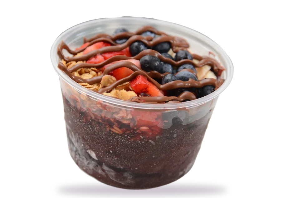 Açaí bowl with strawberries, blueberries, granola and Nutella